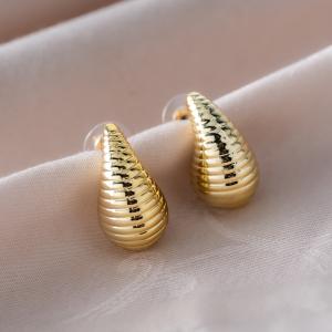 Artificial earrings with a ribbed teardrop-like shape